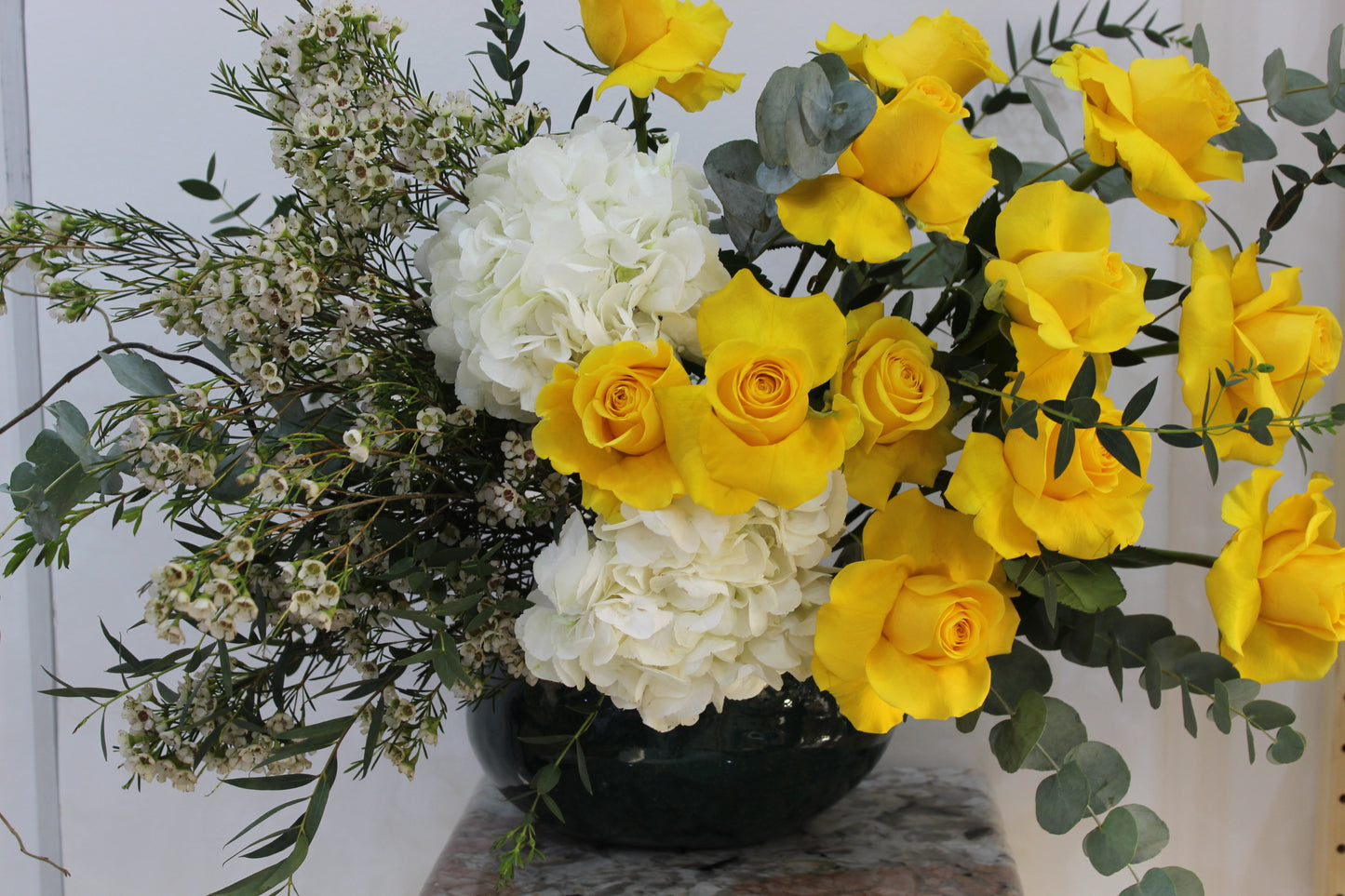 Heart of open roses in atlentic vase